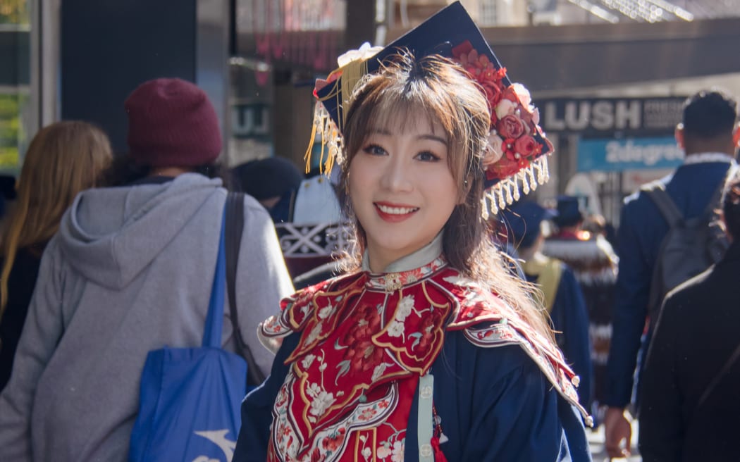 Lavender Feng combined traditional Chinese clothing with her graduation gown at her graduation at Otago Polytechnic in 2023.