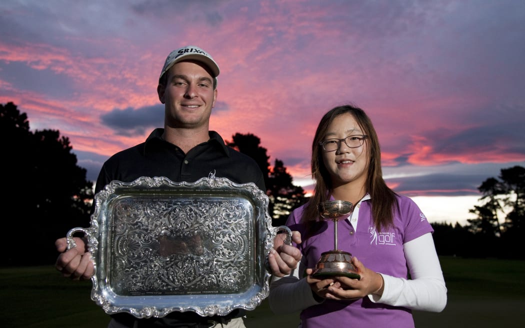 Ryan Fox and Lydia Ko with their respective trophies following their wins at the 2011 New Zealand amateur strokeplay championships in Christchurch.