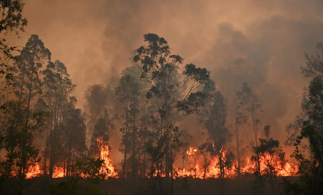 A fire rages in Bobin, 350km north of Sydney on 9 November.