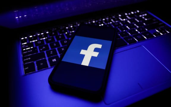 Facebook logo is seen displayed on a phone screen in this illustration photo taken in November 2020