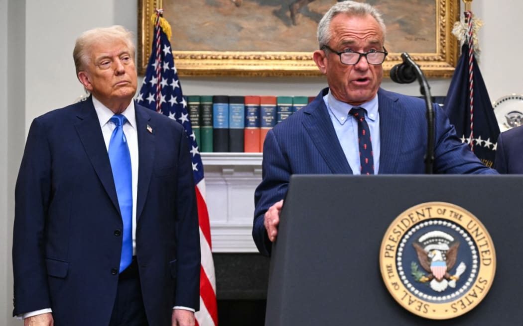 US President Donald Trump looks on as US Secretary of Health and Human Services Robert F. Kennedy Jr. speaks during an event about autism in the Roosevelt Room of the White House in Washington, DC on 22 September, 2025.