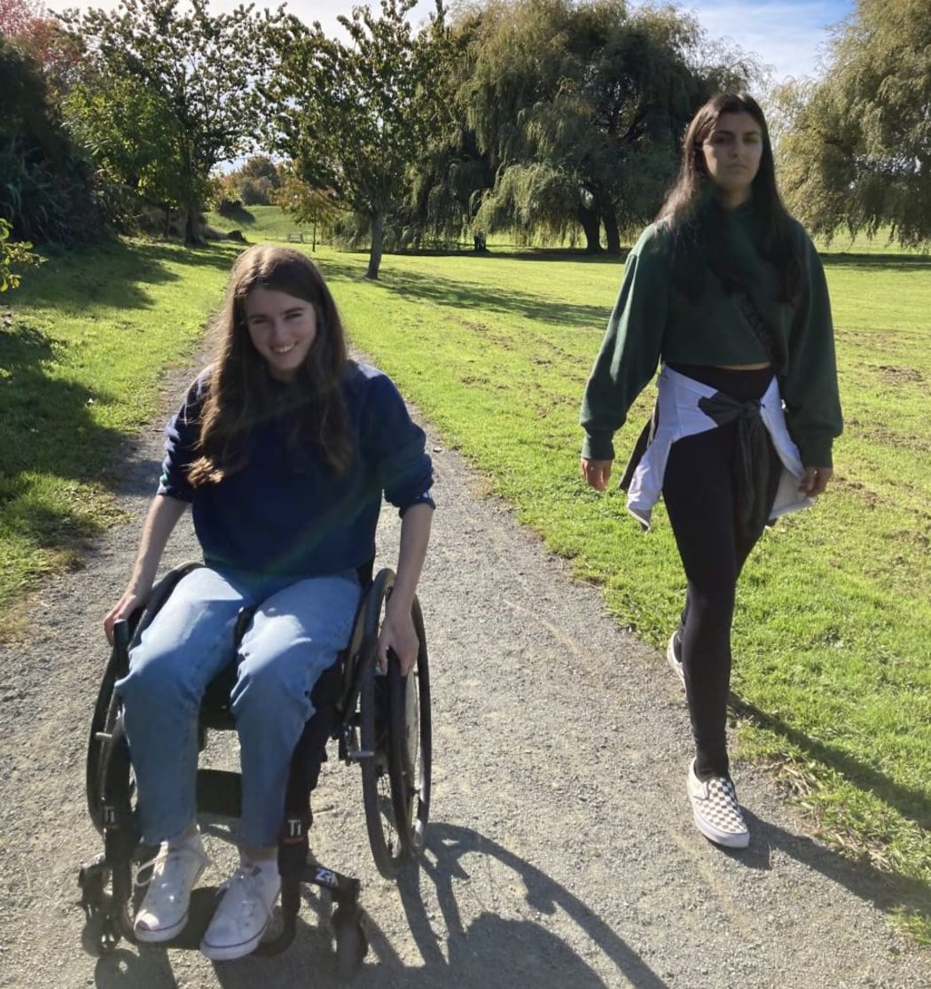 Sophia Malthus and her caregiver and friend Indy.