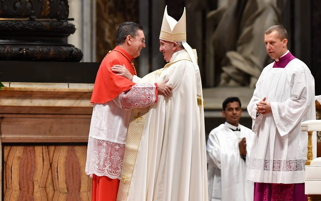 Pope Francis (R) greets Spanish prelate Miguel Angel Ayuso Guixot prior to appointing him Cardinal,