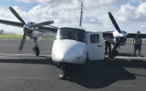The damaged Twin Commando aircraft.