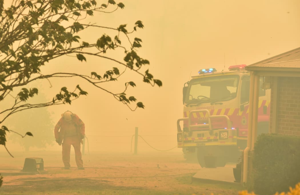 A firefighter at Balmoral, 150km south-west of Sydney, 19 December.