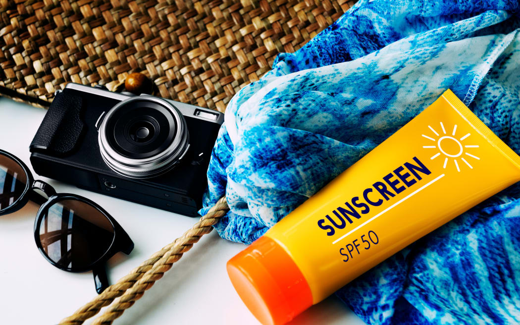 Packing Beach Camera Sunscreen Concept