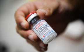 A nurse holds a vial of Moderna Covid-19 vaccine in a social center of La Gavotte Peyret popular neighbourhood, in Septeme-Les-Vallons, near Marseille, on January 12, 2022.