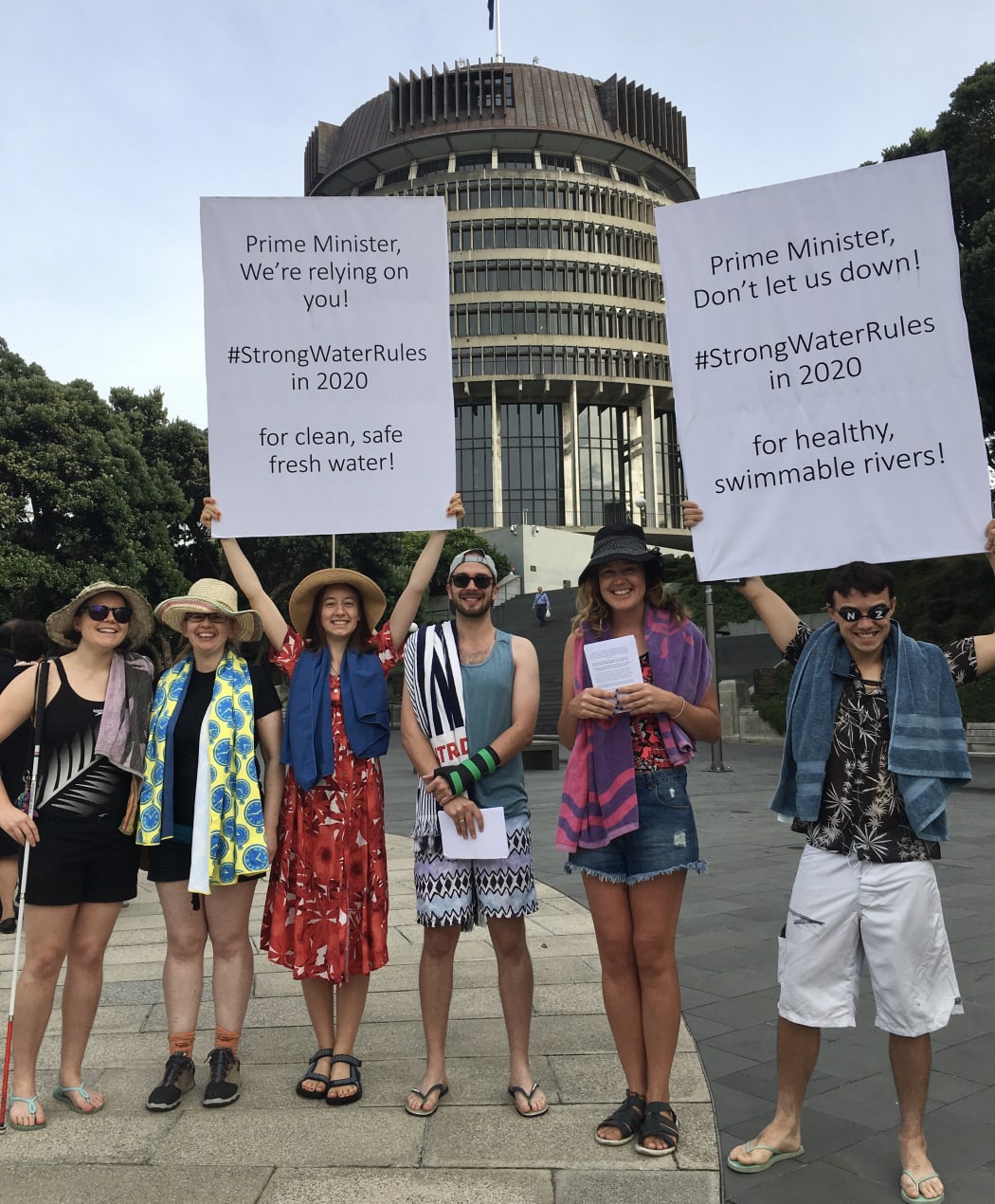 Choose Clean Water don togs and towels in Parliament grounds this morning.