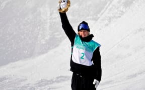 Zoi Sadowski Synnott celebrates winning the silver medal in the women's snowboarding big air finals during the Beijing 2022 Olympic Winter Games at Big Air Shougang.