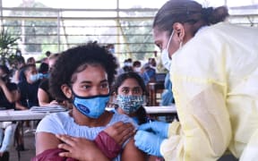 Children and teens being vaccinated in Fiji.