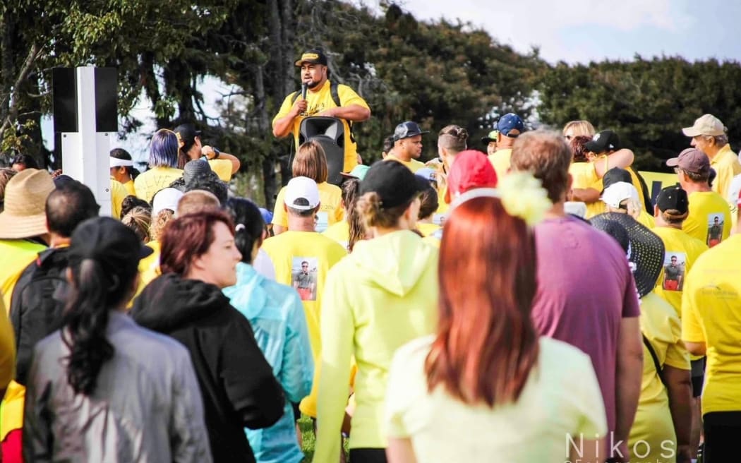 Iosefo Joseph Fa'afiu,(holding microphone on stage) founder of HopeWalk, a suicide prevention movement