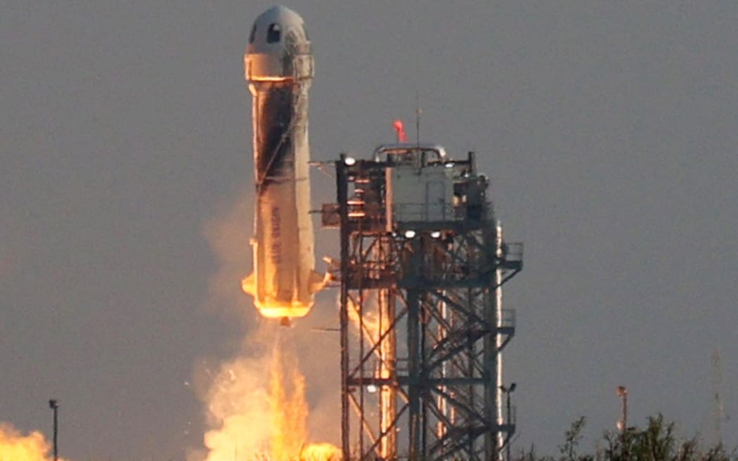 VAN HORN, TEXAS - JULY 20: Blue Origins New Shepard lifts-off from the launch pad carrying Jeff Bezos along with his brother Mark Bezos, 18-year-old Oliver Daemen, and 82-year-old Wally Funk on July 20, 2021 in Van Horn, Texas.