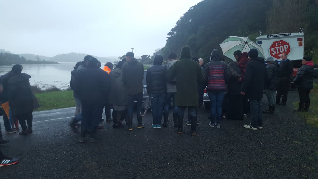 Whanau of Mona Waikoko Tuwhangai and Maurice Raymond O'Donnell perform a karakia as their bodies are taken away from their homestead.