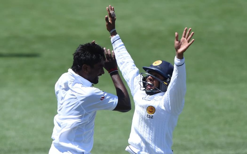 Dushmantha Chameera celebrates with Kusal Mendis at Seddon Park in Hamilton, New Zealand. Saturday 19 December 2015. Copyright photo: Andrew Cornaga / www.photosport.nz