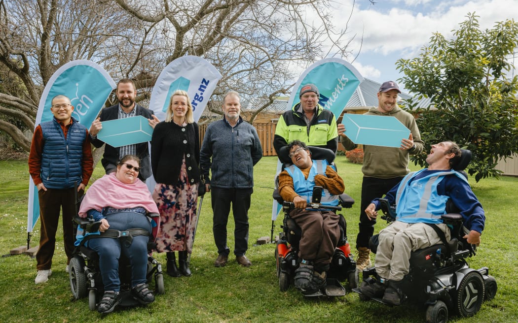 Construction of the new Rowan Apartments is well underway. From left to right is Jack Ding (Sharp Consulting), Evelyn Churchill (Rowan Apartments Project Committee and also a Rowan flatter), Andrew Wordsworth (Enliven Disability Service Manager), Tess Fenwick (Tess Fenwick Architects), Hamish Panton (Aquair Engineering), Chad Cooper and Geoffrey Edwards (Rowan flatters), behind Chad is Julian Davis and Scott Mogford (Davcon Construction).