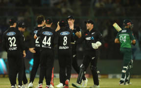 New Zealand's players celebrate the dismissal of Pakistan's Shan Masood during the fifth and final one-day international in Karachi 2023.