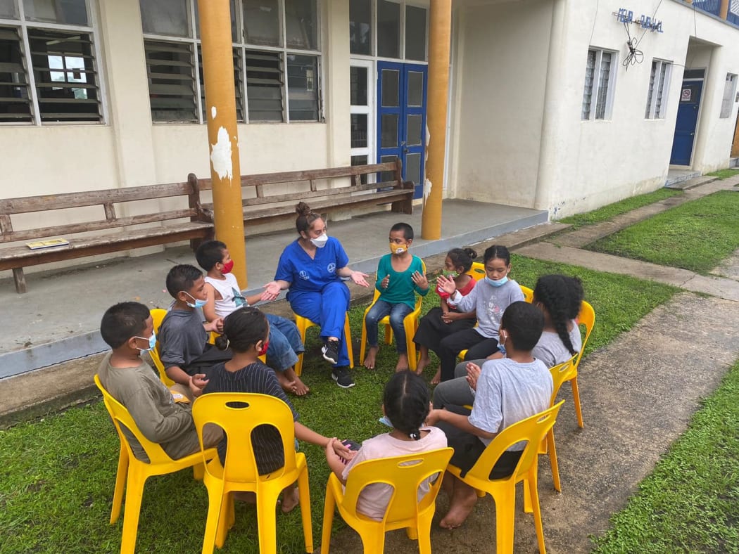 PACMAT nurse Mary-Rose Muller with children from Mango Island