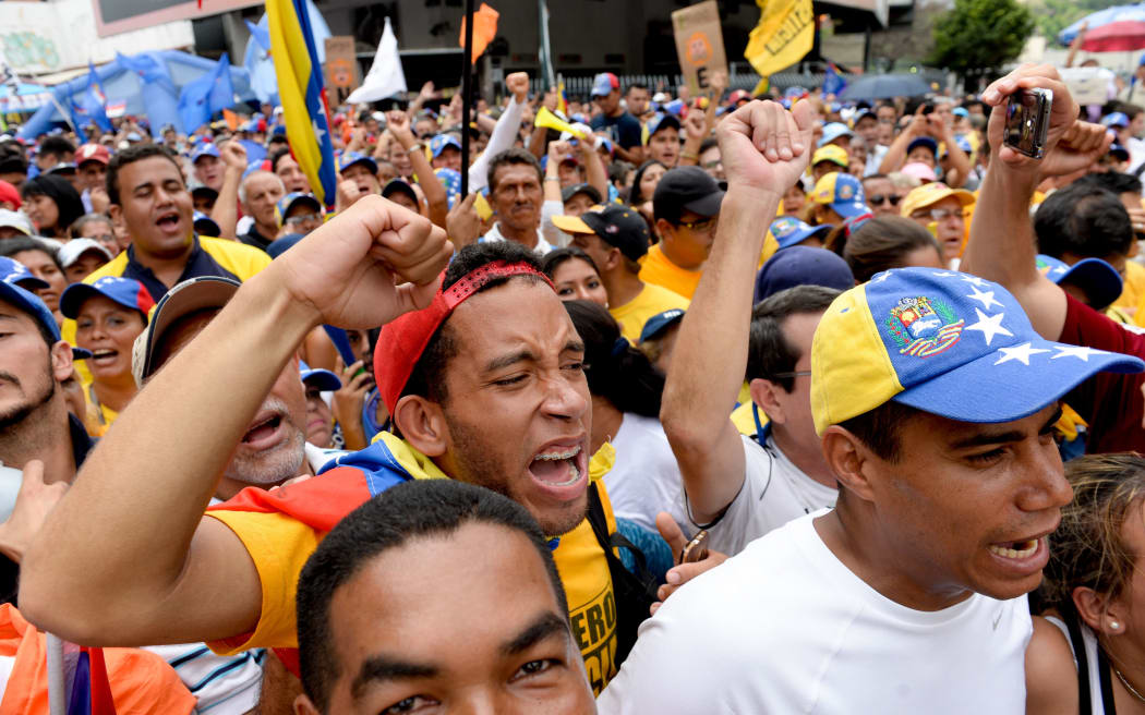 Opponents of the government of Venezuelan President Nicolas Maduro take part in a demonstration in Caracas.