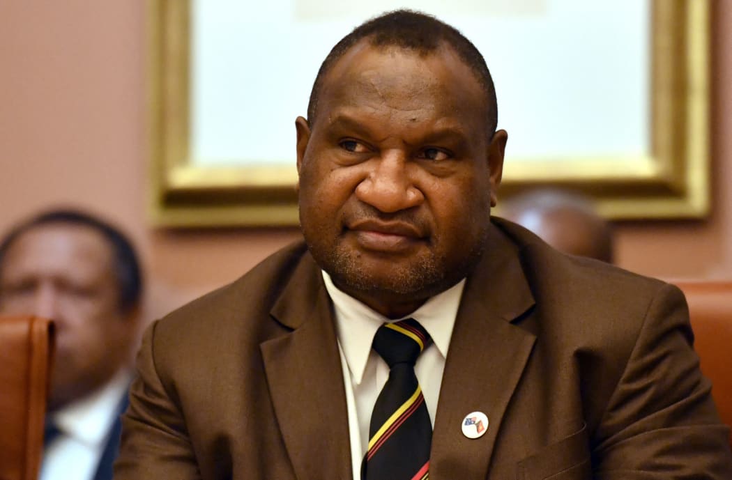 Papua New Guinea's Prime Minister James Marape listens to Australia's Prime Minister Scott Morrison during a meeting at Parliament House in Canberra on July 22, 2019. - Marape is on a six-day visit to Australia. (Photo by MICK TSIKAS / POOL / AFP)