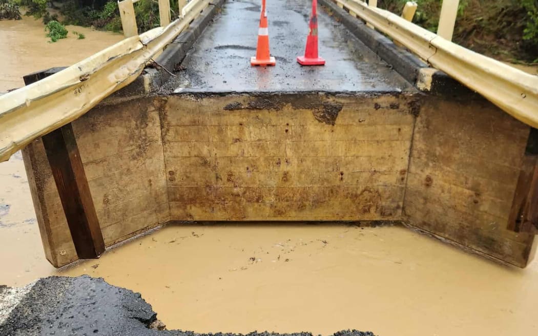 The Ngaiotonga Bridge itself is undamaged but the approach has been washed out.