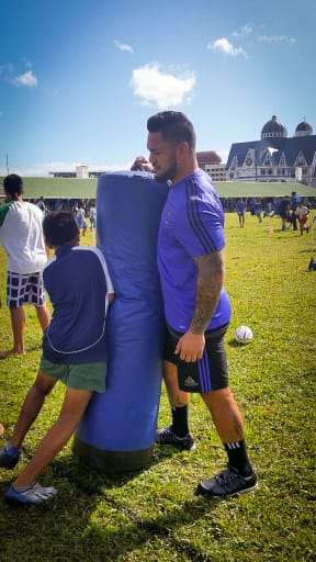 All black Hika Elliot puttng a boy through his paces.