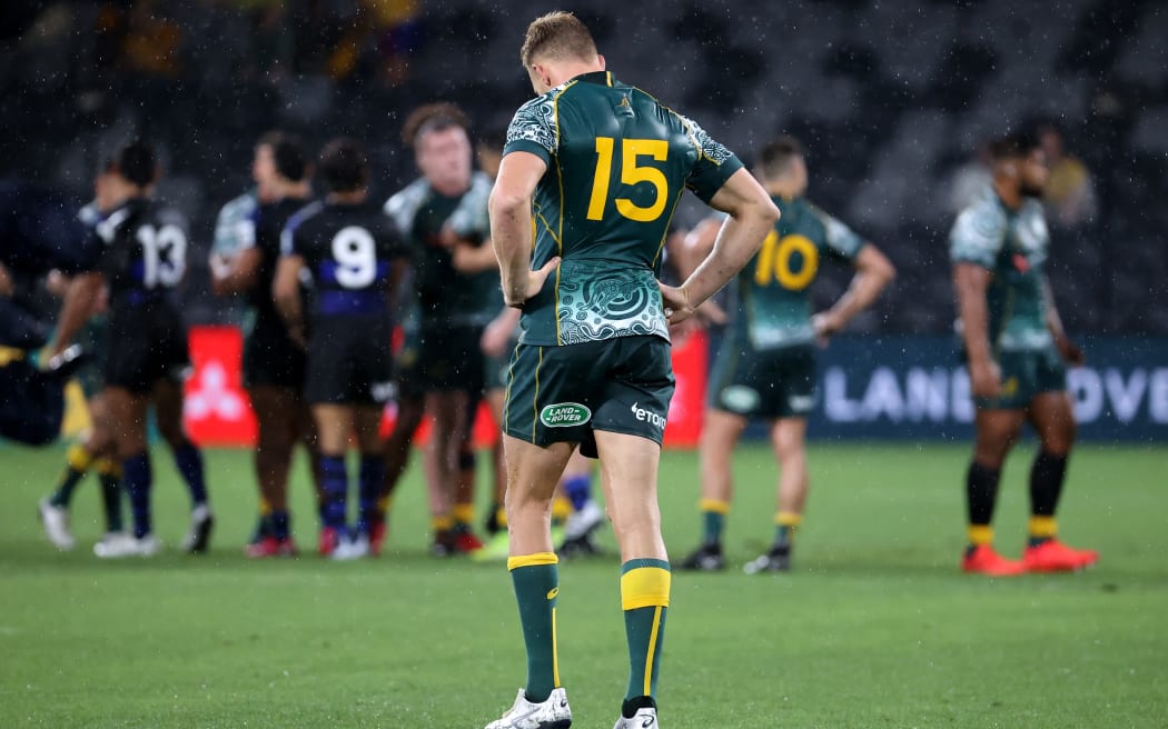 Australia's Reece Hodge (C) walks back at the end of the 2020 Tri-Nations rugby match between the Australia and Argentina in Sydney on December 5, 2020.