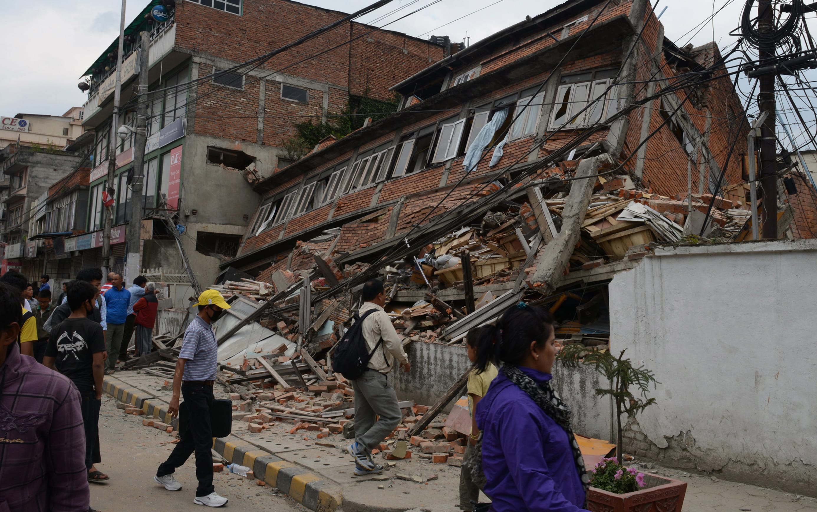 The earthquake - which hit last night (NZDT) - has toppled houses, office blocks and historic buildings in Kathmandu.