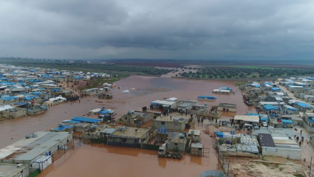 An aerial view of a refugee camp flooded after heavy rain on December 27, 2018 in Idlib, Syria. Tens of thousands of Syrian refugees in camps near the Turkish border are struggling to survive harsh winter conditions.