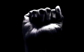 raised fist in black and white