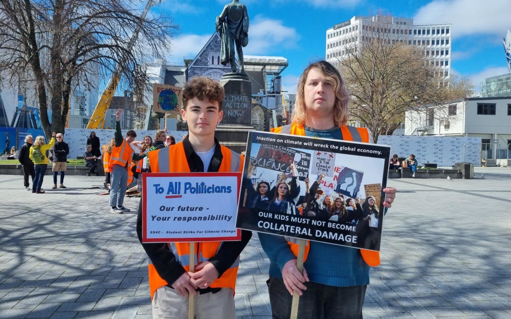 People are starting to gather in Christchurch's Cathedral Square for the School Strike for Climate Action, including Oscar Compton-Moen and Carter Andrew.