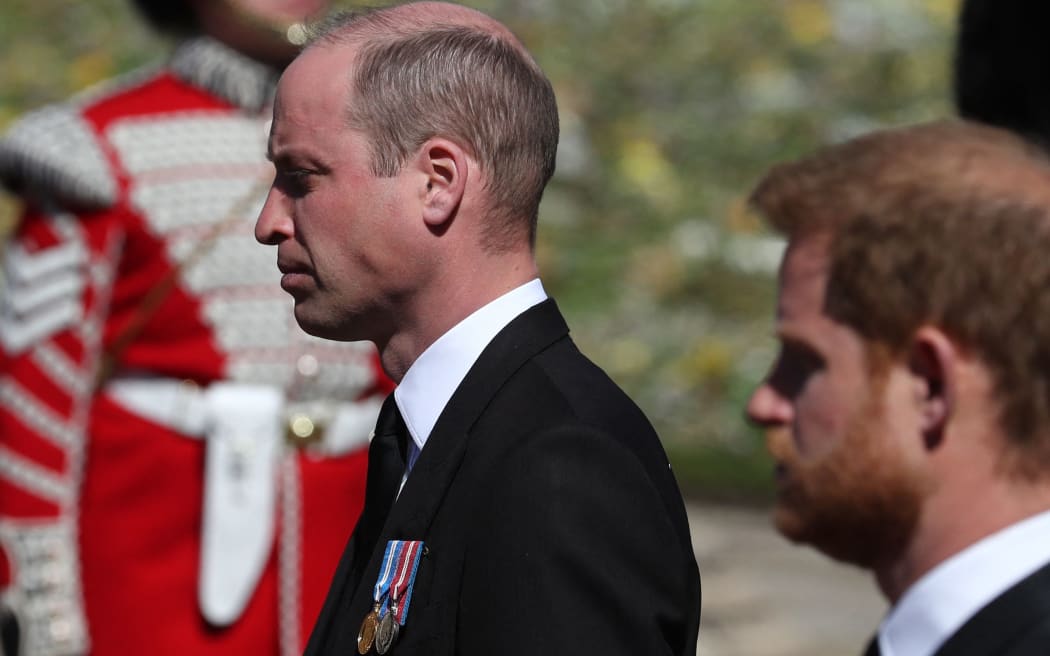 Britain's Prince William, Duke of Cambridge (L) and Britain's Prince Harry, Duke of Sussex follow the coffin during the ceremonial funeral procession of Britain's Prince Philip, Duke of Edinburgh to St George's Chapel in Windsor Castle in Windsor, west of London, on April 17, 2021.