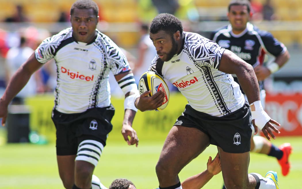 An action photo of Fiji's Nemani Nagusa making a break to score in the match V USA during the Hertz Wellington Rugby Sevens - Day 2, 2 February 2013.