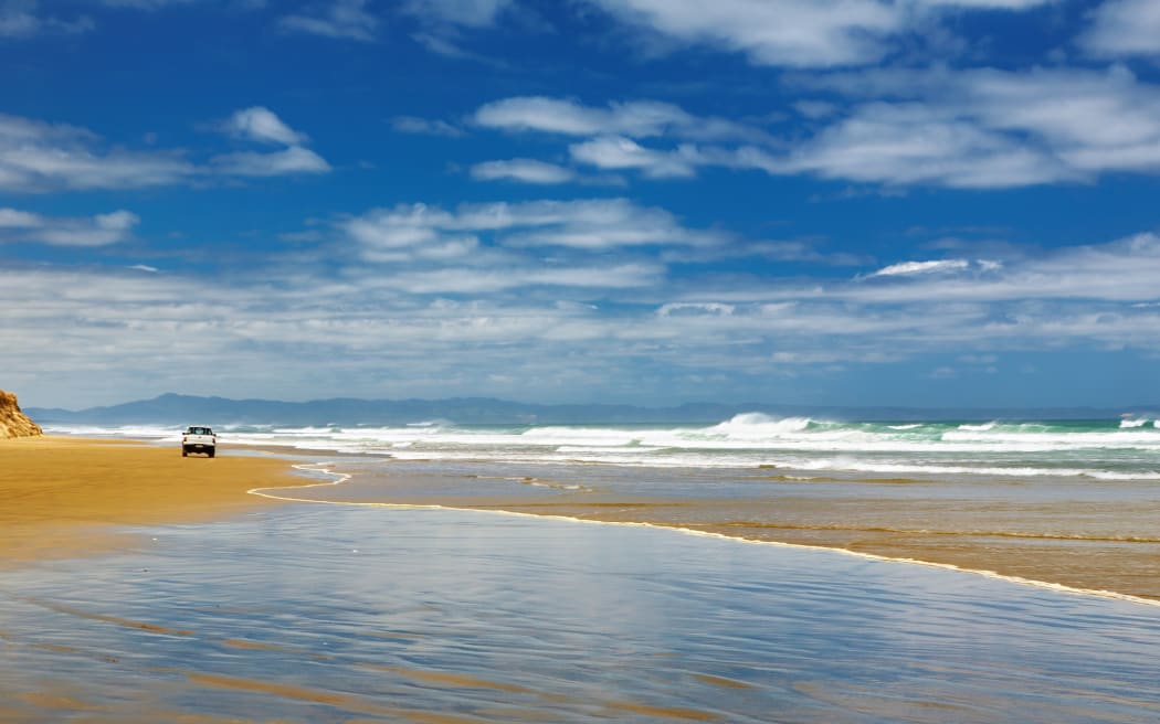 Car on the beach, Ninety Mile Beach, New Zealand