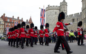 Soldiers from the Queen's Guard prepare for the 'Changing of the Guard' ceremony at Windsor Castle, west of London, on May 18, 2012, as Britain's Queen Elizabeth II hosts a lunch for sovereign monarchs to commemorate the diamond jubilee. The king of Bahrain, whose regime has been accused of human rights abuses, will attend a lunch of foreign monarchs Friday to mark Queen Elizabeth II's diamond jubilee, officials said.