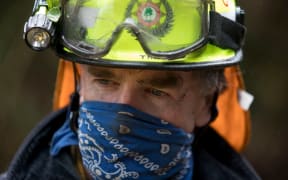 Firefighter Port Hills blaze. Photo posted 18 February 2017.