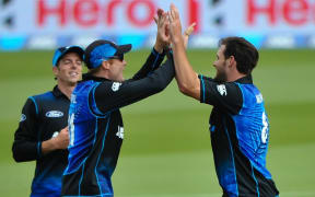 Mitchell Santner (L), Martin Guptill (C) and Mitchell McClenaghan celebrate a wicket during the second ODI vs Sri Lanka, Hagley Oval, Christchurch, 28th December 2015. Copyright Photo: John Davidson / www.photosport.nz