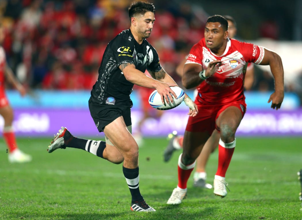 Tevita Pangai Junior tries to close down hat-trick hero Shaun Johnson.