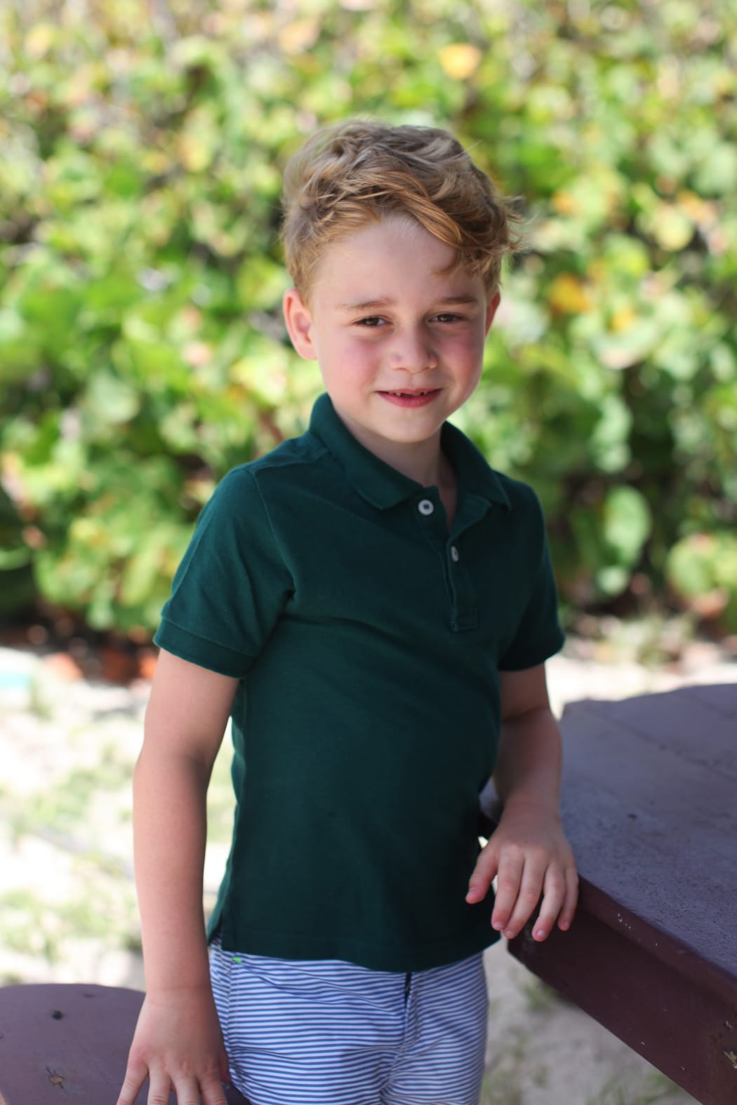 Prince George, in the garden of Kensington Palace, in a photo taken by the Duchess of Cambridge to mark the prince's sixth birthday.