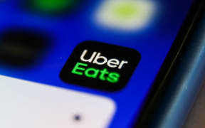 Uber Eats icon is seen displayed on a phone screen in this illustration photo taken in Krakow, Poland on April 9, 2021. (Photo by Jakub Porzycki/NurPhoto) (Photo by Jakub Porzycki / NurPhoto / NurPhoto via AFP)