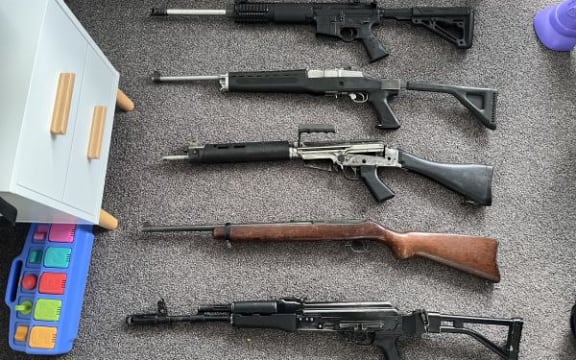 Five military-style firearms were found in children's bedrooms during the search of a house in Napier.