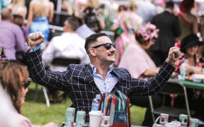 Crowds excited for New Zealand Trotting Cup at Addington Raceway in Christchurch.
