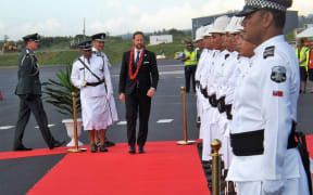 Norway Crown Prince, HRH Haakon inspects Samoa's Royal Police Guard of Honour after arriving at Faleolo International Airport.
