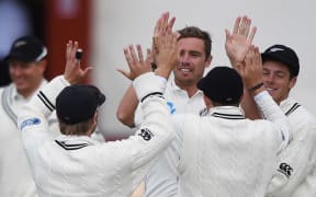 Team-mates congratulate Tim Southee after the dismissal of Ajantha Mendis during play on day 4 of the 1st cricket test match between New Zealand Black Caps and Sri Lanka at University Oval, Dunedin. Sunday 13 December 2015. Copyright photo: Andrew Cornaga / www.photosport.nz