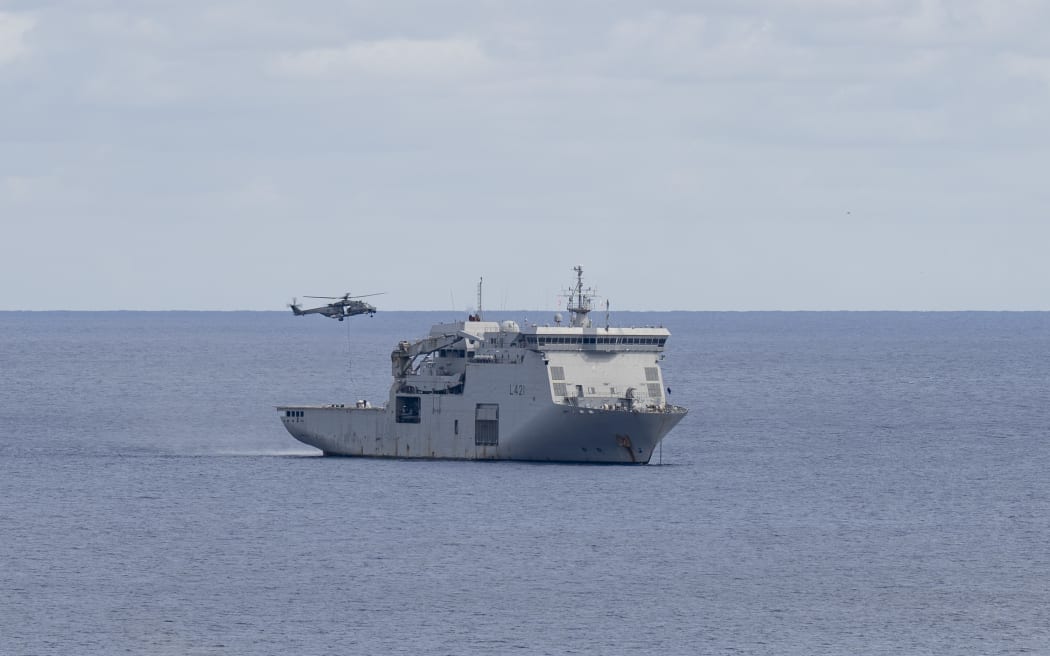 NH90 transporting loads from HMNZS Canterbury to shore at Raoul Island. Second day on Raoul Island, HMNZS Canterbury send a working party to shore to assist with vegetation clearing to allow governement agencies ease of access to working areas. NZDF contingent assisting carrying out tasks set out by the Department of Conservation, MetService and Earth Science New Zealand to carry out upgrade and maintenance tasks of critical weather, tsunami and volcano monitoring equipment and facilities on Raoul Island (Rangitahua).RNZN ship's company on shore clearing vegetation around working area needed for operation along with help from embarked forces NZ Army 5MOVs and RNZAF 3SQN to deliver and extract equipment from location via two NH90 helicoptersHMNZS Canterbury ship's company and embarked forces on Operation Calypso, deployed to the South West Pacific (2-22 February 2026).