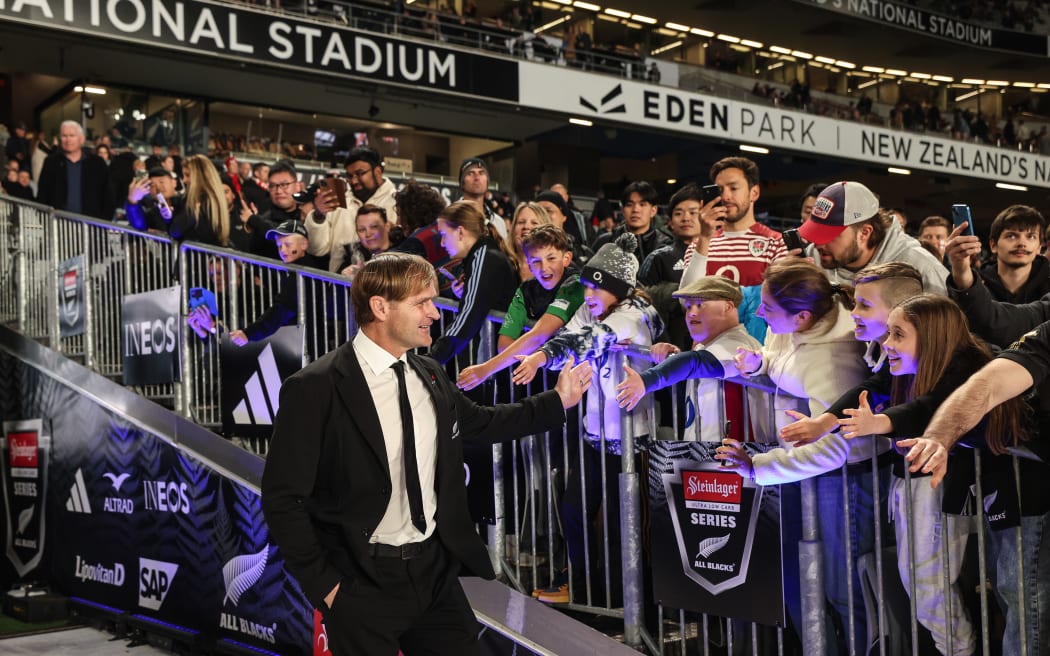 Head coach of New Zealand Scott Robertson greets fans and supporters.