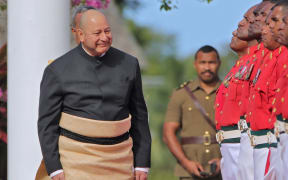 King Tupou VI inspects the guard of honour during his official state visit to Fiji in July 2025.