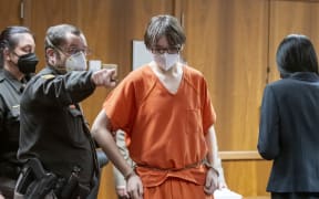 Ethan Crumbley is led away from the courtroom after a placement hearing at Oakland County Circuit Court on February 22, 2022 in Pontiac, Michigan. Crumbley, 15, is charged with the fatal shooting of four fellow students and the wounding of seven others, including a teacher at Oxford High School on November 30, 2021.   David Guralnick-Pool/Getty Images/AFP (Photo by POOL / GETTY IMAGES NORTH AMERICA / Getty Images via AFP)