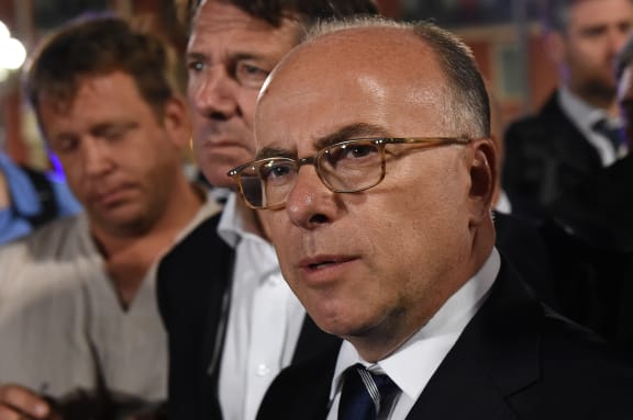 French Interior Minister Bernard Cazeneuve said he would sue for defamation over the "grave accusations" made by a Nice policewoman.