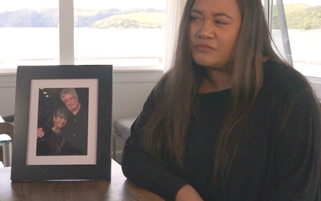 Jo Kutukai with a photo of her parents, Mona Tuwhangai and Maurice O'Donnell. They were both killed by Ross Bremner.