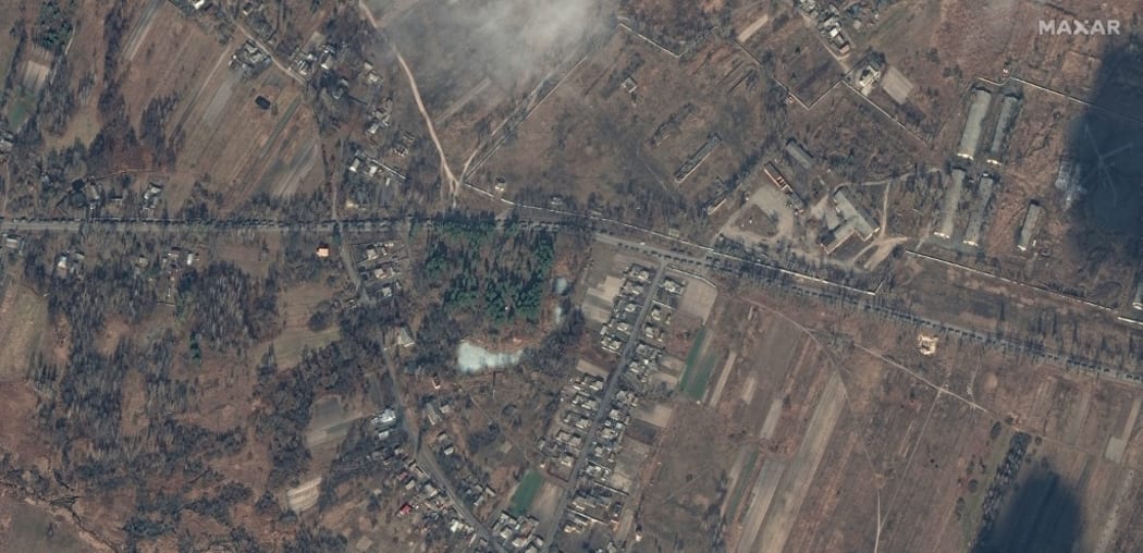 A Maxar satellite image taken and released on 27 February, 2022, shows a column of Russian military vehicles as they move towards Kyiv, on the P-02-02 road (Shevchenka Road) on the outskirts of Ivankiv.